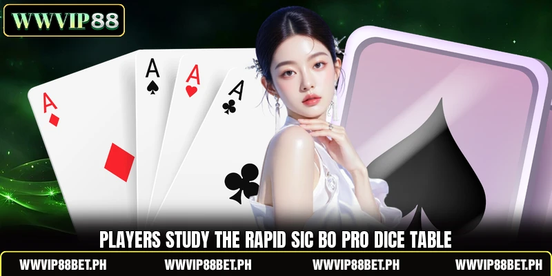 Players study the Rapid Sic Bo Pro dice table Players study the Rapid Sic Bo Pro dice table